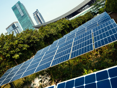 Green future city with solar panels and trees